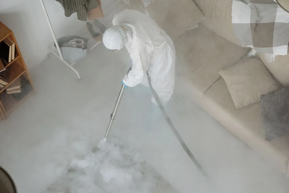 Biohazard cleanup technician in protective equipment, Olivet, TN